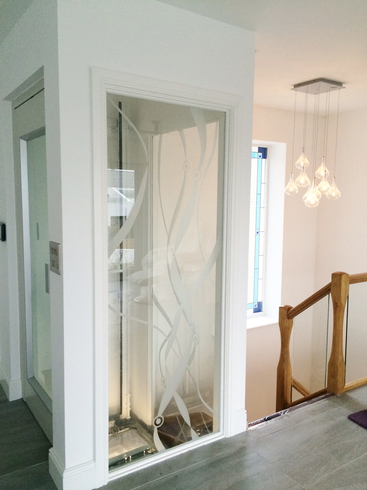 Glass Home Lift in White Structure