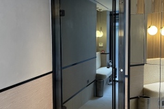 Frameless glass door on the gym entrance to the lift at King Street Townhouse