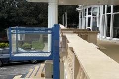 Blue powder-coated outdoor platform lift at the Marsham Court Hotel