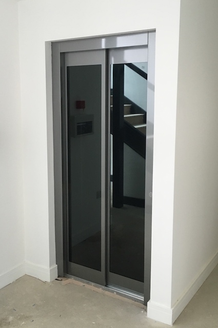 Lift with smoked glass automatic doors in Weymouth