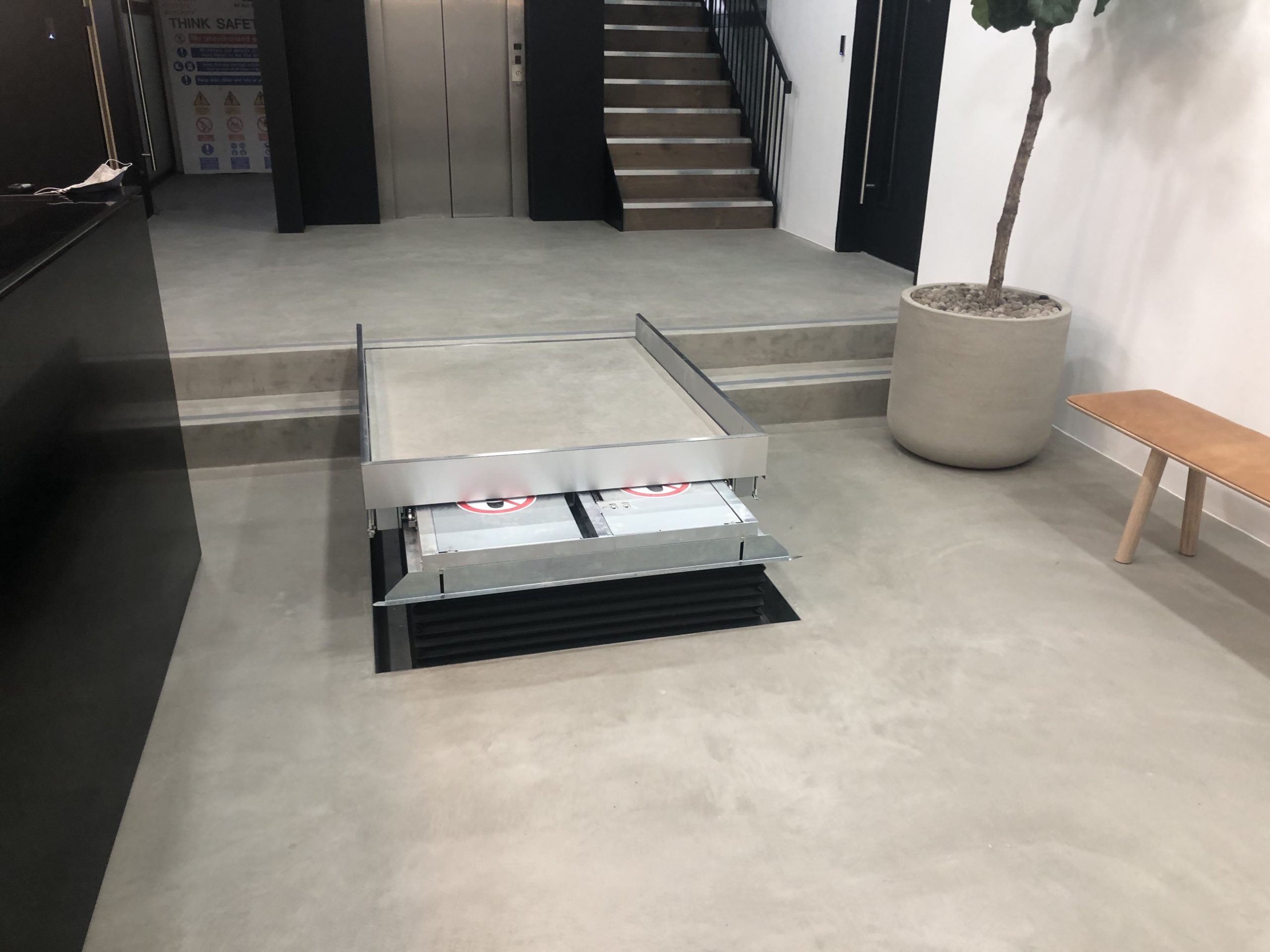 Hidden traversing lift in the reception of 12-16 Laystall Street