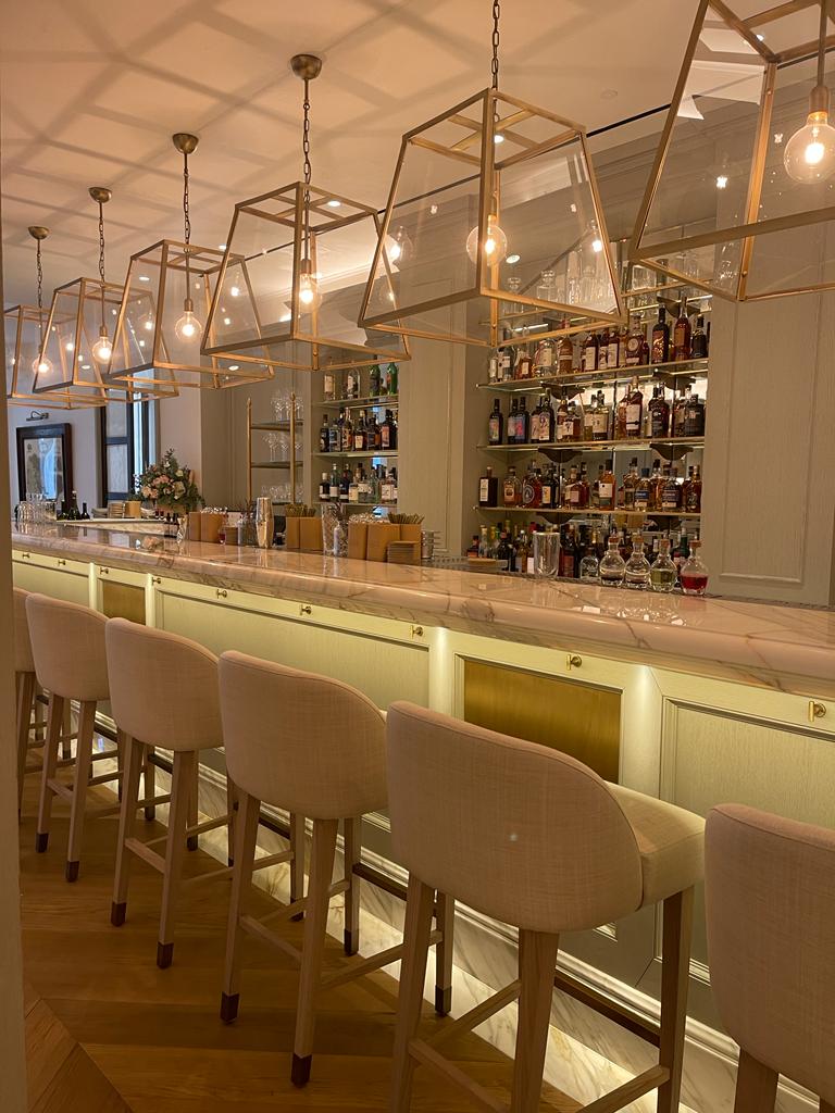 The bar at Il Borro Tuscan Bistro features bronze and brass accents