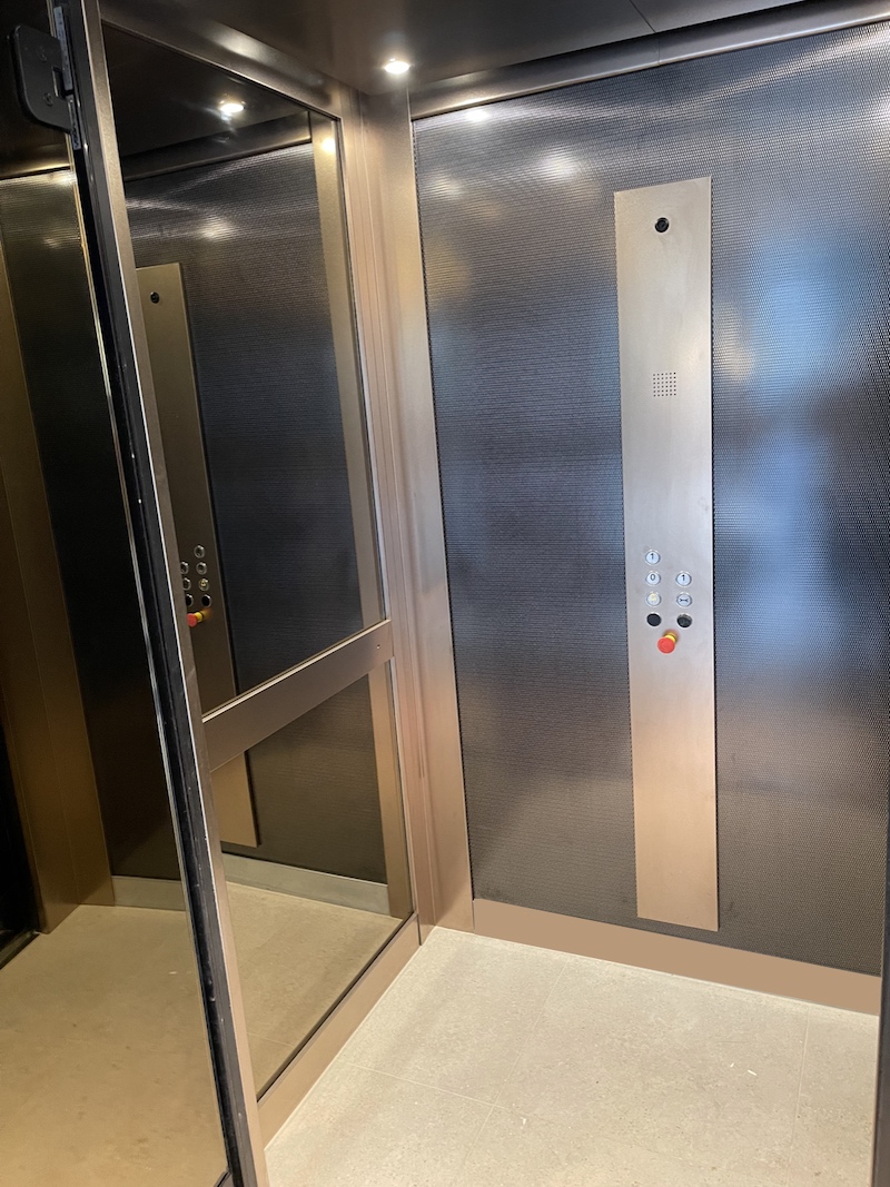 the lift cabin features a bronze mirror